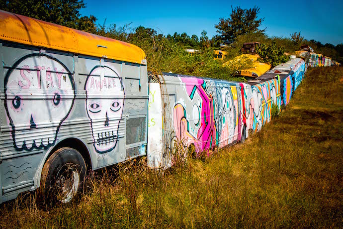 Painted School Bus Fence at Schoolbus Graveyard in North GA_