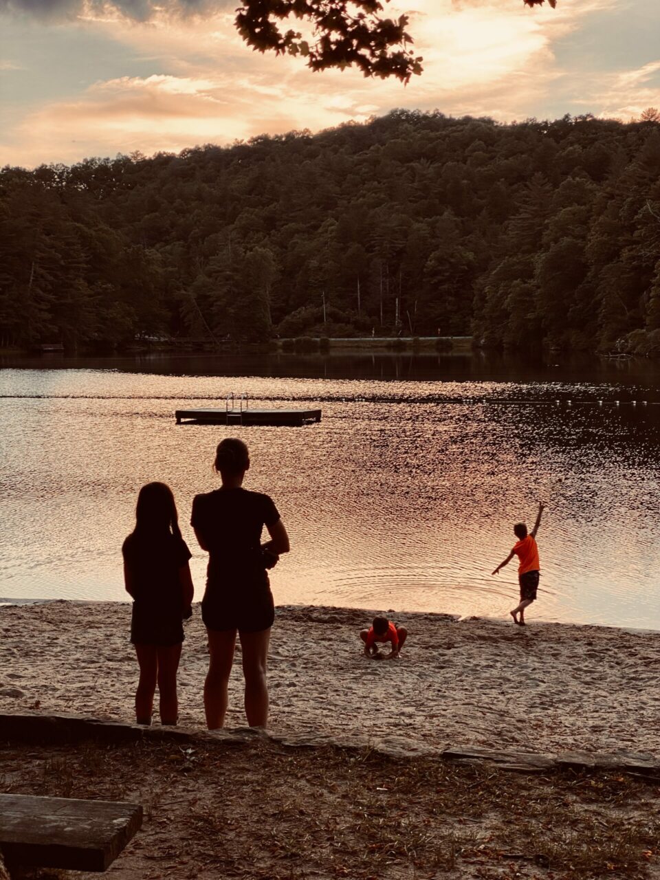 Kids playing on Lake Winfield Scott beach at Sunset