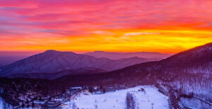 Mountain sunset over ski slope
