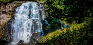 Couple at Rainbow Falls in Gorges State Park near Brevard NC by Bret Love